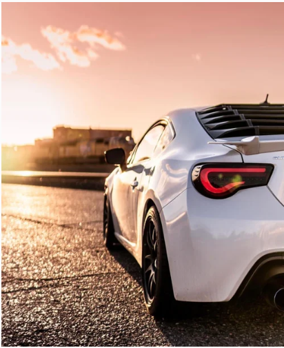 White sports car at sunset